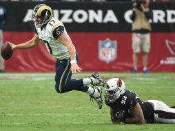 Case Keenum completó un par de engarces en las diagonales con Brian Quick. AFP / N. Hall