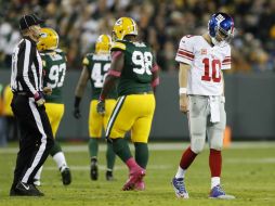 Al final del encuentro, Eli Manning se quedó con 18 pases completos de 35 intentos. AP / M. Ludtke