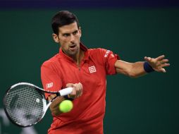 Djokovic, defensor del título, jugará los octavos de final ante el vencedor del partido entre el Grigor Dimitrov y Vasek Pospisil. AFP / J. Eisele