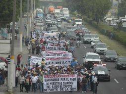 Este miércoles, ejidatarios participaron desde temprana hora en una marcha sobre la carretera a Chapala. EL INFORMADOR / ARCHIVO