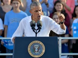 EU no puede elegir a un presidente 'que propone torturar' o 'darle los códigos nucleares a alguien tan imprevisible', afirmó Obama. AFP / S. Davis