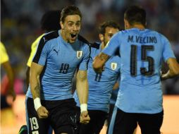 Sebastián Coates, de Uruguay (I), celebra su gol, el primero de su equipo. AFP / P. Porciuncula