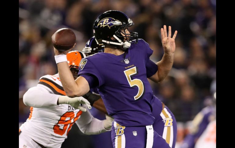 Joe Flacco lanzó para 296 yardas en 30 de 41 intentos. AFP / R. Carr