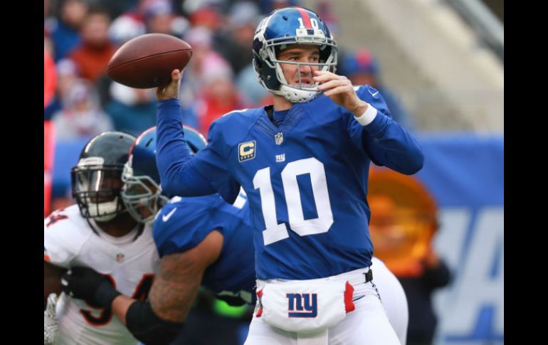 Eli Manning conectó 21 de 36 pases para 227 yardas. AFP / M. Reaves