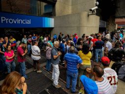 ''No hay dinero en la calle, no hay efectivo y todo está por las nubes'', dice un ama de casa de 30 años.  /