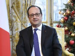 'Iré a expresar directamente a Merkel mi apoyo esta tarde', declaró Hollande. EFE / J. Lempin