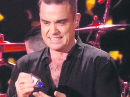 Robbie Williams. El actor protagonizó un momento bochornoso al final de uno de sus espectáculos. ESPECIAL /