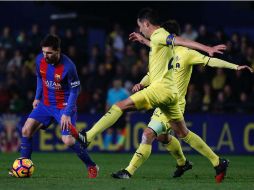 Una ejecución perfecta de falta directa por parte de Messi  le dio el empate al Barcelona. AFP / J. Jordan