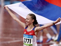 Olga Kaniskina de Rusia celebra al finalizar la caminata de 20 kilómetros en Juegos Olímpicos de Beijing 2008. NTX / ARCHIVO