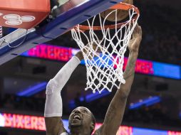 Caldwell-Pope encesta surante el primer cuarto del partido. AP / C. Szagola