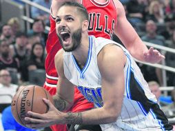 Ataque. Evan Fournir aportó 20 puntos en la remontada del Magic sobre los Bulls. AP / M. Ebenhack