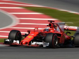 Raikkonen supera por casi cuatro décimas de segundo el tiempo que Sebastian Vettel consiguió el jueves. AFP / L. Gene