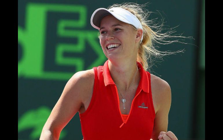 Caroline Wozniacki festeja la obtención de un punto en su partido de ayer. AFP / A. Bello