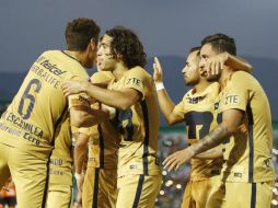 Jugadores de Pumas celebran su triunfo ante Chiapas. MEXSPORT / N. García