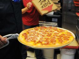 Supuestos repartidores ofrecen pizzas 'canceladas' en la Ciudad de México. AP / ARCHIVO