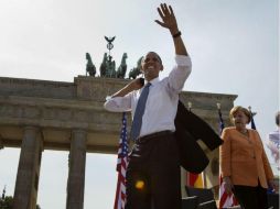 El ex presidente Barack Obama, junto a la Canciller alemana Angela Merkel durante el evento protestante. AP / E. Vucci