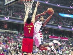 Bradley Beal (#3) tuvo una noche redonda al encabezar la ofensiva de los Wizards con una cosecha de 27 puntos. AFP / R. Carr