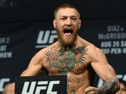 Conor McGregor es campeón de pesos ligeros en la UFC con 21 triunfos y tres derrotas. AFP / ARCHIVO