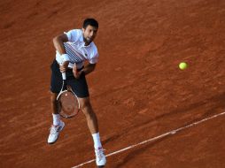 Es la undécima vez que el serbio se mete en cuartos de final en Roland Garros. AFP / L. Bonaventure