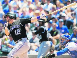 Mark Reynolds (#12) conectó su cuadrangular número 17 de la temporada, ayudando a que los Rockies consoliden el mejor récord. AP / N. Yuh