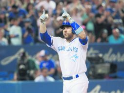 Russell Martin, de los Azulejos, festeja tras conseguir cuadrangular en la sexta entrada ayer ante los Medias Blancas. AFP /