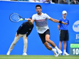 Es la primera vez que Nole acude a un evento en cancha de césped entre Roland Garros y Wimbledon desde 2010. AFP / G. Kirk