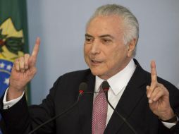 Temer fue acusado por el fiscal anterior de haber sido beneficiario de un soborno, cosa que el mandatario tachó de 'ficción'. AP / E. Peres