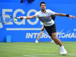 ''Nole'' consiguió al fin lo que necesitaba: confianza sobre hierba para presentarse al tercer grande de la temporada. AFP / G. Kirk