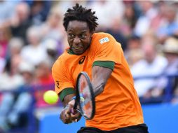 Gael Monfils regresa el saque de Gasquet. AFP / G. Kirk