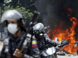 La oposición se manifiesta en las calles en contra de las elecciones que califican de ‘fraudulentas’. AP / A. Cubillos