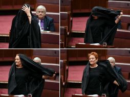 La Senadora Pauline Hanson se quita el burka en la cámara del Senado en el Parlamento en Canberra tras tenerlo puesto 20 minutos. EFE / L. Coch