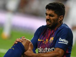 Suárez recibió un golpe en la rodilla cerca del final del partido de vuelta de la Supercopa de España contra el Real Madrid. AFP / G. Bouys