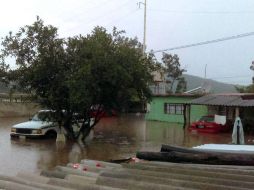 Vehículos y viviendas afectados por las lluvias. NTX / ESPECIAL