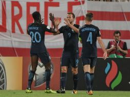 Kane (C) celebra uno de sus dos goles de la noche. AFP / A. Solaro