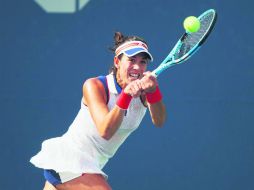 A seguir. Garbiñe Muguruza va por el pase a Cuartos y con la mira en el primer puesto del ranking. AFP /