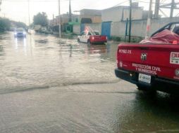 Imagen de la inundación en Camino Viejo a Tesitán y Av. Base Aérea. TWITTER / @UMPCyBZ