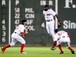 Los Medias Rojas celebran luego de haber derrotado a los Azulejos 6-1. AFP / M. Meyer