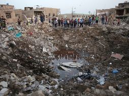 Civilians gather at the site of blasts in Baghdad's Sadr City - Civilians gather at the site of blasts in Baghdad's Sadr City, Iraq, Thursday, June 7, 2018. A pair of explosions ripped through a mosque in a mostly Shiite district of Iraq's capital Wednesday, security officials said. (AP Photo/Karim Kadim) APTOPIX Iraq Explosions