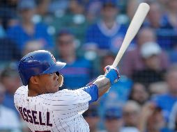 El Addison Russell se voló la barda con casa llena en la quinta entrada. AP/J. Young