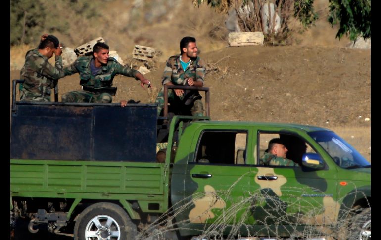 Soldados llegan a Quneitra, en Siria, en el cruce fronterizo con los Altos del Golán. AP/A. Schalit