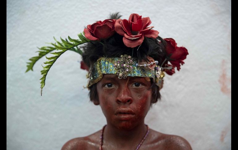 Un niño disfrazado de diablito rojo se ve en un templo en Managua, durante las fiestas populares más concurridas de Nicaragua, en honor de Santo Domingo de Guzmán. EFE/J. Torres