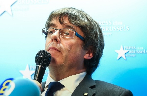 Catalonia's dismissed leader Carles Puigdemont - Catalonia's dismissed leader Carles Puigdemont, along with other members of his dismissed government address a press conference at The Press Club in Brussels on October 31, 2017. Puigdemont, dismissed by the Spanish government on October 27 after Catalonia's parliament declared independence, reportedly drove hundreds of kilometres (miles) to Marseille in France and then flew to Belgium. / AFP / Aurore Belot BELGIUM-SPAIN-CATALONIA-POLITICS