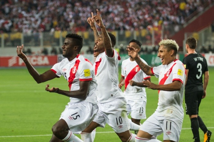 Peru's Christian Ramos (L) celebrates with teammates after scoring ag - Peru's Christian Ramos (L) celebrates with teammates after scoring against New Zealand during their 2018 World Cup qualifying play-off second leg football match, in Lima, Peru, on November 15, 2017. / AFP / Ernesto BENAVIDES FBL-WC-2018-PER-NZL